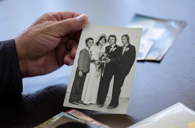 Juraj Pievac (70) shows an old photo from his wedding remembering his wife, who was killed in a landmine explosion in the village of Brodani near Karlovac on March 24, 2026. More than 30 years after the independence war, that left behind around 107,000 landmines and 470,000 unexploded ordnances, Croatia is declared mine-free, a historic milestone for the country. (Photo by MARKO PERKOV / AFP)
