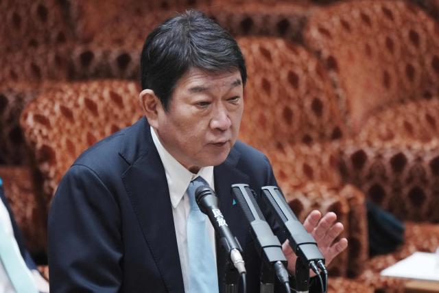 Japan's Foreign Minister Toshimitsu Motegi answers questions about the situation in the Middle East at a budget committee session of the House of Councillors at Parliament in Tokyo on April 7, 2026. (Photo by Kazuhiro NOGI / AFP)