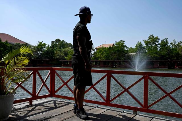 Cambodian Pheap Rom poses for picture at a restaurant in Phnom Penh on March 30, 2026. A Cambodian refugee long-settled in the United States, ex-convict Pheap Rom, remains bewildered at how he wound up behind bars in the African nation of Eswatini for months after being swept up in Donald Trump's deportation blitz. (Photo by TANG CHHIN Sothy / AFP) / To go with 'Cambodia-Eswatini-US-Migrants-Rights-Crime' Focus by Suy Se and Matt Surrusco