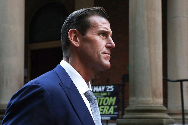 (FILES) A file photo taken on May 1, 2025 shows former member of Australia's elite Special Air Service regiment Ben Roberts-Smith leaving the Federal Court in Sydney. Police arrested on April 7, 2026, one of Australia's most-decorated soldiers for alleged war crimes in Afghanistan on April 7, 2025, local media reported, following a sweeping investigation into the conduct of the nation's elite commandos. The Australian Federal Police said they arrested a 47-year-old former Australian soldier, who was widely named in local media as Victoria Cross recipient Ben Roberts-Smith. (Photo by Saeed KHAN / AFP)