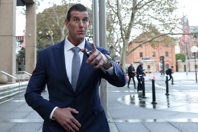 (FILES) A file photo taken on May 1, 2025 shows former member of Australia's elite Special Air Service regiment Ben Roberts-Smith leaving the Federal Court in Sydney. Police arrested on April 7, 2026, one of Australia's most-decorated soldiers for alleged war crimes in Afghanistan on April 7, 2025, local media reported, following a sweeping investigation into the conduct of the nation's elite commandos. The Australian Federal Police said they arrested a 47-year-old former Australian soldier, who was widely named in local media as Victoria Cross recipient Ben Roberts-Smith. (Photo by Saeed KHAN / AFP)