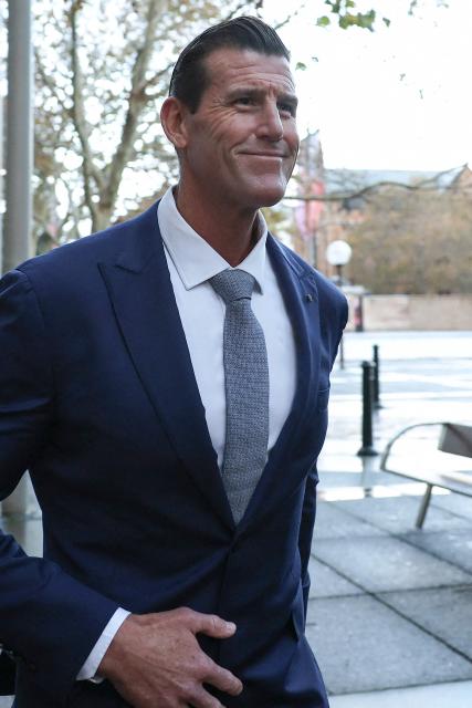 (FILES) A file photo taken on May 1, 2025 shows former member of Australia's elite Special Air Service regiment Ben Roberts-Smith leaving the Federal Court in Sydney. Police arrested on April 7, 2026, one of Australia's most-decorated soldiers for alleged war crimes in Afghanistan on April 7, 2025, local media reported, following a sweeping investigation into the conduct of the nation's elite commandos. The Australian Federal Police said they arrested a 47-year-old former Australian soldier, who was widely named in local media as Victoria Cross recipient Ben Roberts-Smith. (Photo by Saeed KHAN / AFP)