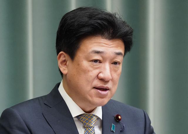 Japan's Chief Cabinet Secretary Minoru Kihara holds a press conference at the Prime Minister's Office in Tokyo on April 7, 2026. Iran freed a Japanese national held since January, Tokyo said April 7, with Kyodo News reporting that the person was believed to be the Tehran bureau chief of broadcaster NHK. (Photo by JIJI PRESS / AFP) / Japan OUT