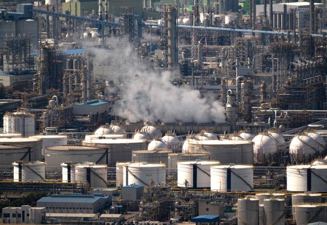 This general view shows oil tanks and facilities at Yeosu National Industrial Complex, the largest petrochemical industrial complex in South Korea, in Yeosu on April 7, 2026. (Photo by Shin Yong-ju / AFP)