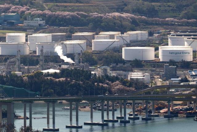 This general view shows oil tanks and facilities at Yeosu National Industrial Complex, the largest petrochemical industrial complex in South Korea, in Yeosu on April 7, 2026. (Photo by Shin Yong-ju / AFP)