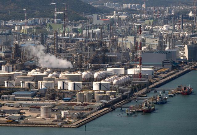 This general view shows oil tanks and facilities at Yeosu National Industrial Complex, the largest petrochemical industrial complex in South Korea, in Yeosu on April 7, 2026. (Photo by Shin Yong-ju / AFP)