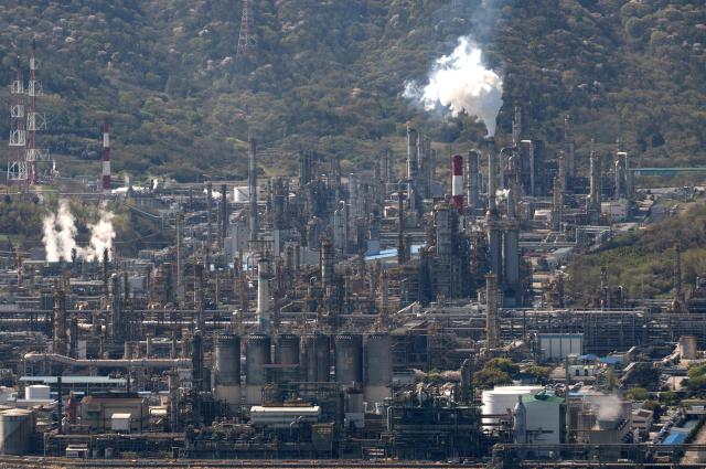 This general view shows oil tanks and facilities at Yeosu National Industrial Complex, the largest petrochemical industrial complex in South Korea, in Yeosu on April 7, 2026. (Photo by Shin Yong-ju / AFP)