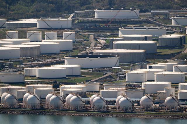 This general view shows oil tanks and facilities at Yeosu National Industrial Complex, the largest petrochemical industrial complex in South Korea, in Yeosu on April 7, 2026. (Photo by Shin Yong-ju / AFP)