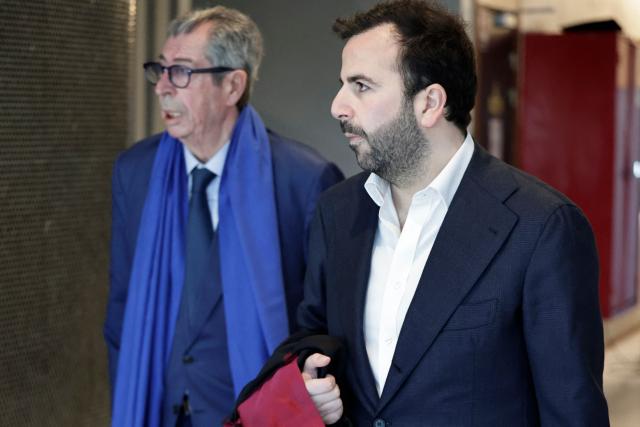 Defendant and former mayor of Levallois-Perret Patrick Balkany (L) arrives with his lawyer Robin Binsard for his the trial for embezzlement in Nanterre west of Paris, on April 7, 2026. (Photo by STEPHANE DE SAKUTIN / AFP)