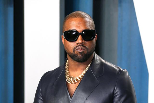 (FILES) Kanye West attends the 2020 Vanity Fair Oscar Party following the 92nd annual Oscars at The Wallis Annenberg Center for the Performing Arts in Beverly Hills on February 9, 2020. One of the promoters of an annual London music festival on April 6, 2026 defended plans for Kanye West to headline it, amid a backlash over the US rapper's previous antisemitic outbursts. Disgraced 48-year-old hip-hop star West -- now known as Ye -- is due to play three nights at the Wireless Festival in the British capital in July as part of a European comeback tour. (Photo by JEAN-BAPTISTE LACROIX / AFP)