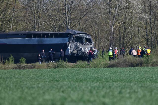 TOPSHOT - This photograph shows part of the TGV train after its collision at a level crossing after is collision with a lorry between Bethune and Lens, in Bully-les-Mines, in the Pas-de-Calais region, northern France on April 7, 2026. The driver of a TGV train died and 27 people were injured in the accident, AFP has learnt from the prefecture and the SNCF. (Photo by Sameer AL-DOUMY / AFP)