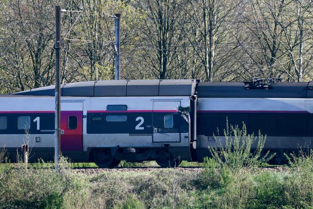 This photograph shows part of the TGV train after its collision at a level crossing after is collision with a lorry between Bethune and Lens, in Bully-les-Mines, in the Pas-de-Calais region, northern France on April 7, 2026. The driver of a TGV train died and 27 people were injured in the accident, AFP has learnt from the prefecture and the SNCF. (Photo by Sameer AL-DOUMY / AFP)