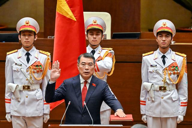 Vietnam's newly elected Prime Minister Le Minh Hung takes an oath during the National Assembly session in Hanoi on April 7, 2026. Vietnam's parliament elected Le Minh Hung as prime minister on April 7, after Vietnam Communist Party boss To Lam was elected president by the National Assembly, capping his bid to centralise authority in a nation where senior cadres have traditionally governed collectively. (Photo by Dang ANH / AFP)