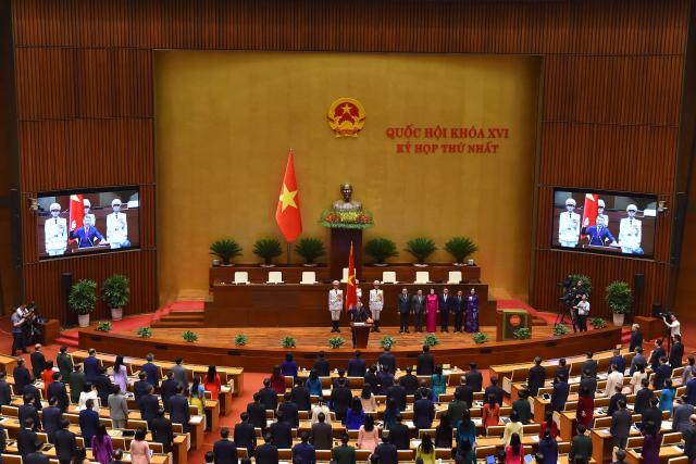 Vietnam's newly elected Prime Minister Le Minh Hung takes an oath during the National Assembly session in Hanoi on April 7, 2026. Vietnam's parliament elected Le Minh Hung as prime minister on April 7, after Vietnam Communist Party boss To Lam was elected president by the National Assembly, capping his bid to centralise authority in a nation where senior cadres have traditionally governed collectively. (Photo by AFP)
