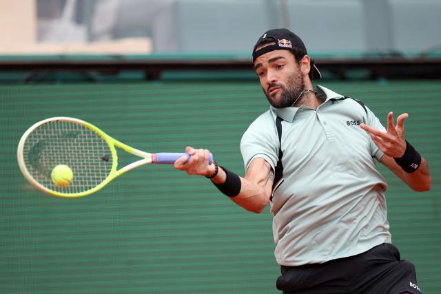 Italy's Matteo Berrettini plays a forehand return to Spain's Roberto Bautista Agut during the Monte Carlo ATP Masters Series Tournament round of 64 tennis match on Court Rainier III at the Monte-Carlo Country Club in Roquebrune-Cap-Martin, south-eastern France on April 7, 2026. (Photo by Valery HACHE / AFP)
