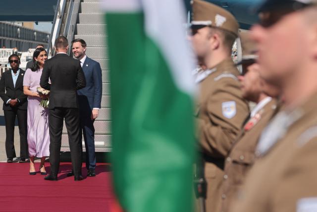US Vice President JD Vance (4th L) and his wife, US second lady Usha Vance (2nd L) arrive at Budapest Ferenc Liszt International Airport in Budapest, Hungary, April 7, 2026. US Vice President JD Vance arrived in Hungary to deliver US President Donald Trump's support to his ally, nationalist Prime Minister Viktor Orban, ahead of tightly contested parliamentary elections scheduled for April 12, 2026. (Photo by Jonathan Ernst / POOL / AFP)