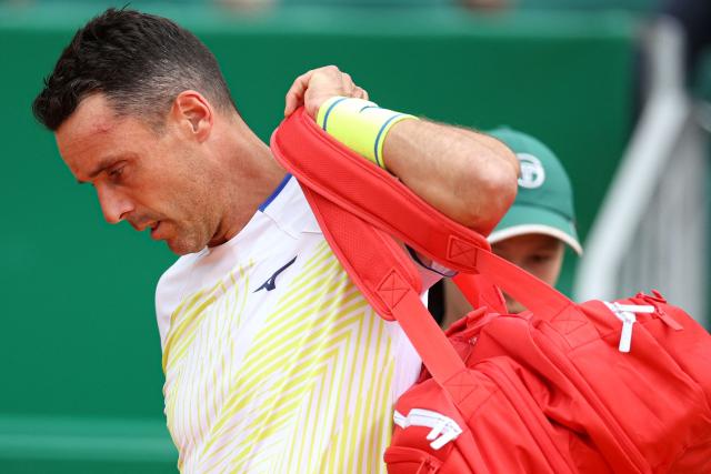 Spain's Roberto Bautista Agut leaves the court to retire after playing against Italy's Matteo Berrettini during the Monte Carlo ATP Masters Series Tournament round of 64 tennis match on Court Rainier III at the Monte-Carlo Country Club in Roquebrune-Cap-Martin, south-eastern France on April 7, 2026. (Photo by Valery HACHE / AFP)