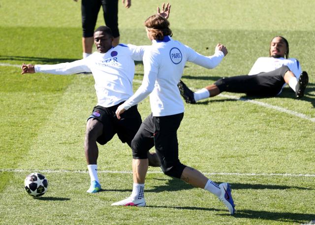 Paris Saint-Germain's Portuguese defender #25 Nuno Mendes (L) fights for the ball with Paris Saint-Germain's Ukrainian defender #06 Illia Zabarnyi during a training session at the Campus Paris Saint-Germain in Poissy, in the western outskirts of Paris, on April 7, 2026, on the eve of the UEFA Champions League last 8 first leg football match between Paris Saint-Germain and Liverpool. (Photo by FRANCK FIFE / AFP)