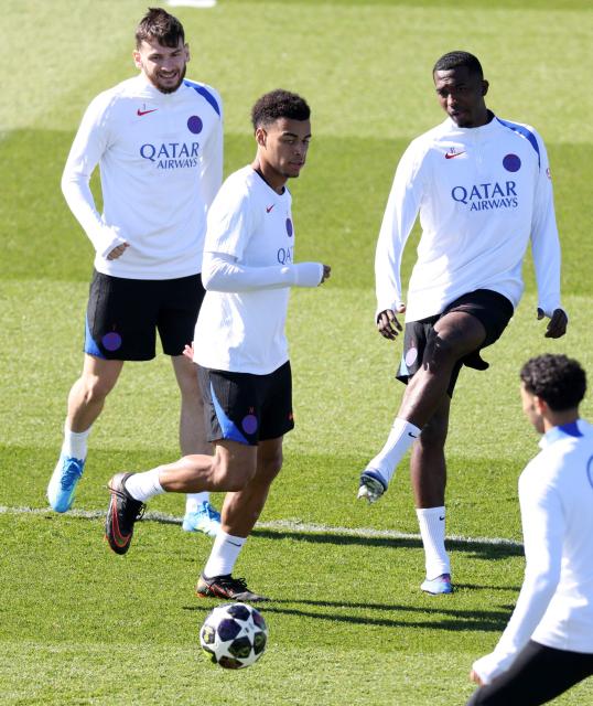 (From L) Paris Saint-Germain's Georgian forward #07 Khvicha Kvaratskhelia, Paris Saint-Germain's French forward #14 Desire Doue and Paris Saint-Germain's French defender #51 William Pacho take part in a training session at the Campus Paris Saint-Germain in Poissy, on the western outskirts of Paris on April 7, 2026, on the eve of the UEFA Champions League quarter-final first leg football match against Liverpool F.C. (Photo by FRANCK FIFE / AFP)