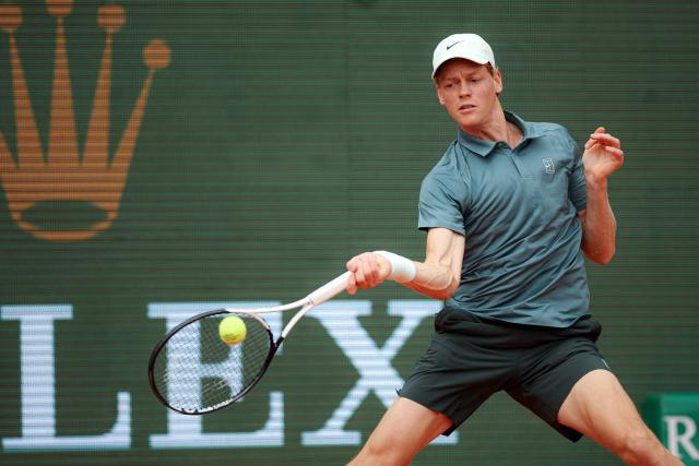 Italy's Jannik Sinner plays a forehand return to France's Ugo Humbert during the Monte Carlo ATP Masters Series Tournament round of 64 tennis match on Court Rainier III at the Monte-Carlo Country Club in Roquebrune-Cap-Martin, south-eastern France on April 7, 2026. (Photo by Valery HACHE / AFP)