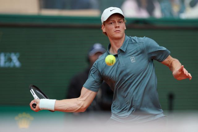 Italy's Jannik Sinner plays a forehand return to France's Ugo Humbert during the Monte Carlo ATP Masters Series Tournament round of 64 tennis match on Court Rainier III at the Monte-Carlo Country Club in Roquebrune-Cap-Martin, south-eastern France on April 7, 2026. (Photo by Valery HACHE / AFP)