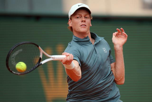 Italy's Jannik Sinner plays a forehand return to France's Ugo Humbert during the Monte Carlo ATP Masters Series Tournament round of 64 tennis match on Court Rainier III at the Monte-Carlo Country Club in Roquebrune-Cap-Martin, south-eastern France on April 7, 2026. (Photo by Valery HACHE / AFP)