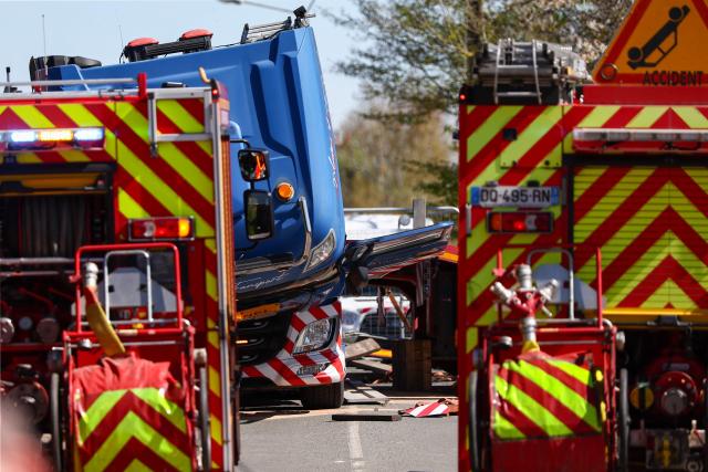 This photograph shows the weckrage of a lorry after its collision with a TGV train at a level crossing between Bethune and Lens, in Bully-les-Mines, in the Pas-de-Calais region, northern France on April 7, 2026. The driver of the TGV train died and 27 people were injured in the accident, AFP has learnt from the prefecture and the SNCF. (Photo by Sameer AL-DOUMY / AFP)