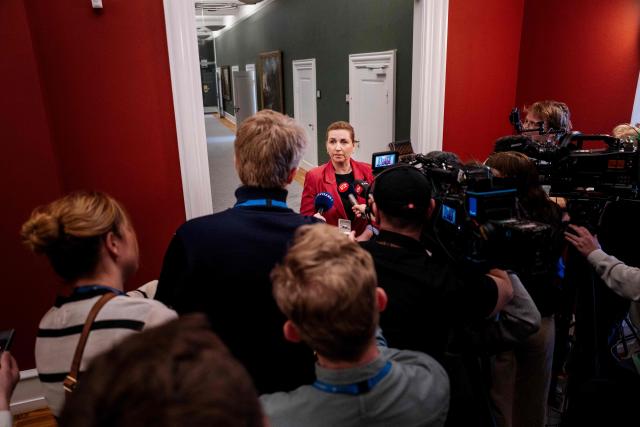 Denmark's acting Prime Minister Mette Frederiksen speaks with journalists to comment on the situation in Iran and the Strait of Hormuz, in front of the Prime Minister's Office in the Danish Parliament, Christiansborg, in Copenhagen, Denmark, on April 7, 2026. (Photo by Sebastian Elias Uth / Ritzau Scanpix / AFP) / Denmark OUT