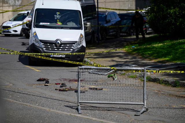 This general view show bloodstained material on a road near The Israeli Consulate in Istanbul on April 7, 2026, following a shootout between gunmen and police. One gunman was killed and two others were wounded in a shootout with police outside the Israeli consulate in Istanbul, the local governor said, adding two officers were lightly wounded (Photo by Yasin AKGUL / AFP)