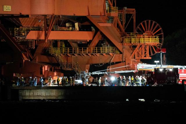 Emergency workers are seen at the JFE Steel East Japan Works Keihin District construction site, where scaffolding collapsed during the dismantling of a crane, in Kawasaki, Kanagawa prefecture on April 7, 2026. Three workers were left unconscious after a 40-metre-high scaffold collapsed at a steelworks near Tokyo, local media reported on April 7. (Photo by Yuichi YAMAZAKI / AFP)