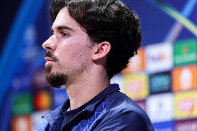 Paris Saint-Germain's Portuguese midfielder #17 Vitinha addresses media representatives during a press conference at the Campus Paris Saint-Germain in Poissy, on the western outskirts of Paris on April 7, 2026, on the eve of the UEFA Champions League quarter-final first leg football match against Liverpool F.C. (Photo by FRANCK FIFE / AFP)