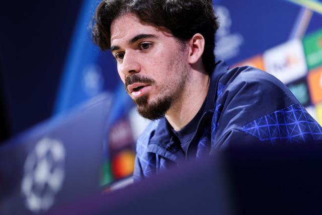 Paris Saint-Germain's Portuguese midfielder #17 Vitinha addresses media representatives during a press conference at the Campus Paris Saint-Germain in Poissy, on the western outskirts of Paris on April 7, 2026, on the eve of the UEFA Champions League quarter-final first leg football match against Liverpool F.C. (Photo by FRANCK FIFE / AFP)