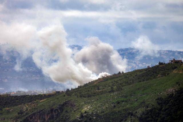 Smoke rises following an Israeli airstrike on the village of Yohmor in southern Lebanon as seen from nearby Marjeyoun (Marjayoun) on April 7, 2026. The Israeli military said on April 7 that it had completed the deployment of ground troops along a "defence line" in southern Lebanon, where it is fighting Iran-backed Hezbollah. The military has not given any geographical details on the furthest point to which its soldiers have advanced into Lebanese territory. (Photo by AFP)