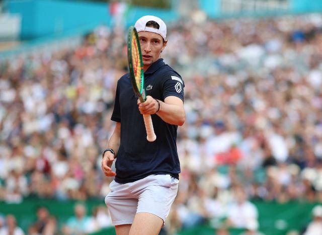France's Ugo Humbert looks on as he plays against Italy's Jannik Sinner during the Monte Carlo ATP Masters Series Tournament round of 64 tennis match on Court Rainier III at the Monte-Carlo Country Club in Roquebrune-Cap-Martin, south-eastern France on April 7, 2026. (Photo by Valery HACHE / AFP)