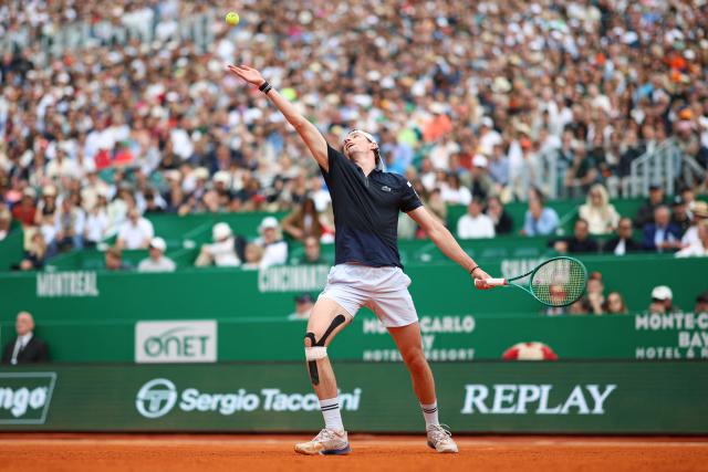 France's Ugo Humbert serves to Italy's Jannik Sinner during the Monte Carlo ATP Masters Series Tournament round of 64 tennis match on Court Rainier III at the Monte-Carlo Country Club in Roquebrune-Cap-Martin, south-eastern France on April 7, 2026. (Photo by Valery HACHE / AFP)