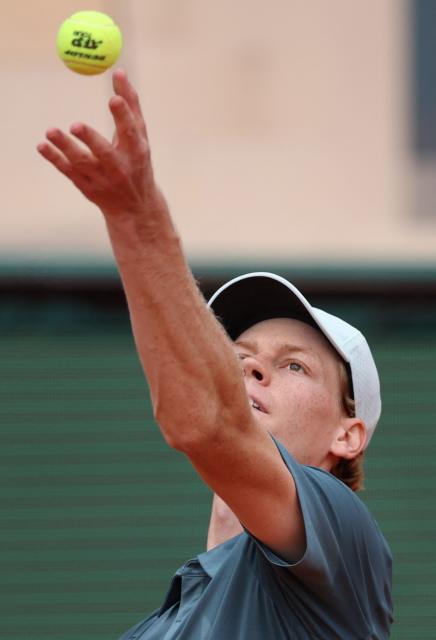 Italy's Jannik Sinner serves to France's Ugo Humbert during the Monte Carlo ATP Masters Series Tournament round of 64 tennis match on Court Rainier III at the Monte-Carlo Country Club in Roquebrune-Cap-Martin, south-eastern France on April 7, 2026. (Photo by Valery HACHE / AFP)