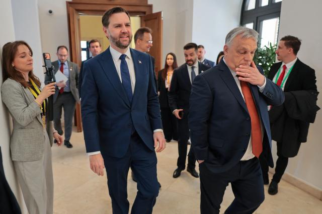 US Vice President JD Vance (L) and Hungarian Prime Minister Viktor Orban walk next to each other during a meeting in Budapest, Hungary, on April 7, 2026. (Photo by Jonathan Ernst / POOL / AFP)