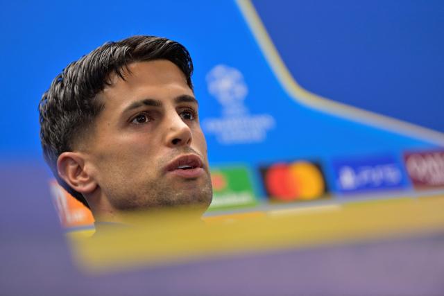 Barcelona's Portuguese defender #02 Joao Cancelo gives a press conference on the eve of their UEFA Champions League quarter final football match against Club Atletico de Madrid at the Joan Gamper training ground in Sant Joan Despi, near Barcelona, on April 7, 2026. (Photo by MANAURE QUINTERO / AFP)