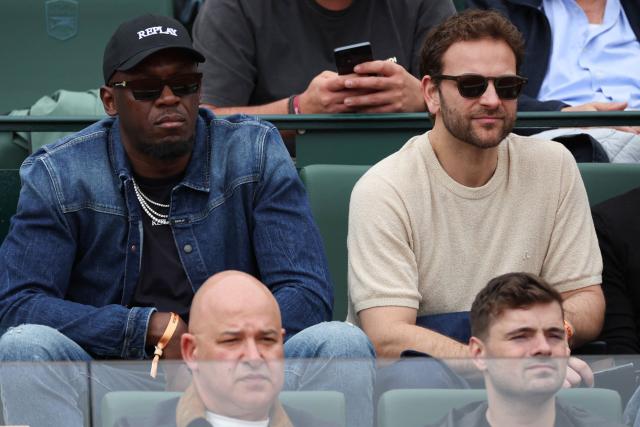 Jamaican former sprinter Usain Bolt (L) and Italian actor Alessandro Borghi attend the Monte Carlo ATP Masters Series Tournament round of 64 tennis match between Italy's Jannik Sinner and France's Ugo Humbert on Court Rainier III at the Monte-Carlo Country Club in Roquebrune-Cap-Martin, south-eastern France on April 7, 2026. (Photo by Valery HACHE / AFP)