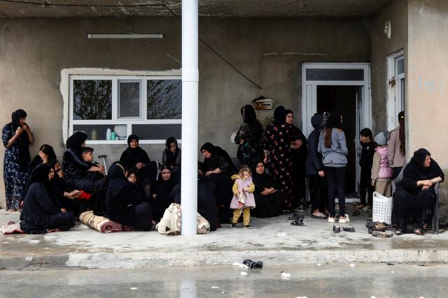 Mourners gather during a condolence ceremony for members of an Iraqi Kurdish family who were killed after a drone crashed into a house in the village of Zargazawi, north of Erbil in Iraq's northern autonomous Kurdistan region, on April 7, 2026. Local authorities reported a deadly drone incident in a civilian area in the early hours of April 7. The autonomous region's Counter-Terrorism Service said a "bomb-laden drone coming from Iran" crashed into a home in the Dara Shakran subdistrict of Erbil province after midnight, killing a couple. Since the Middle East war erupted on February 28, shadowy Iraq-based groups have been claiming near daily attacks on US interests in the country and beyond. (Photo by Safin HAMID / AFP)