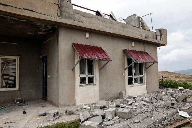 A photograph shows the damage after a drone crashed into a house in the village of Zargazawi, north of Erbil in Iraq's northern autonomous Kurdistan region, on April 7, 2026. Local authorities reported a deadly drone incident in a civilian area in the early hours of April 7. The autonomous region's Counter-Terrorism Service said a "bomb-laden drone coming from Iran" crashed into a home in the Dara Shakran subdistrict of Erbil province after midnight, killing a couple. Since the Middle East war erupted on February 28, shadowy Iraq-based groups have been claiming near daily attacks on US interests in the country and beyond. (Photo by Safin HAMID / AFP)