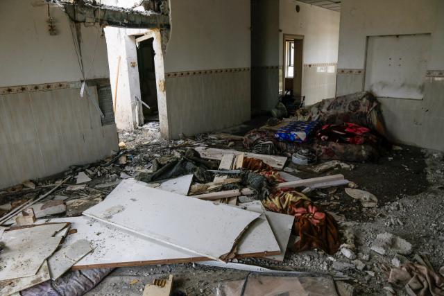 A photograph shows the damage after a drone crashed into a house in the village of Zargazawi, north of Erbil in Iraq's northern autonomous Kurdistan region, on April 7, 2026. Local authorities reported a deadly drone incident in a civilian area in the early hours of April 7. The autonomous region's Counter-Terrorism Service said a "bomb-laden drone coming from Iran" crashed into a home in the Dara Shakran subdistrict of Erbil province after midnight, killing a couple. Since the Middle East war erupted on February 28, shadowy Iraq-based groups have been claiming near daily attacks on US interests in the country and beyond. (Photo by Safin HAMID / AFP)