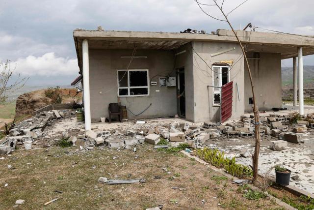 A photograph shows the damage after a drone crashed into a house in the village of Zargazawi, north of Erbil in Iraq's northern autonomous Kurdistan region, on April 7, 2026. Local authorities reported a deadly drone incident in a civilian area in the early hours of April 7. The autonomous region's Counter-Terrorism Service said a "bomb-laden drone coming from Iran" crashed into a home in the Dara Shakran subdistrict of Erbil province after midnight, killing a couple. Since the Middle East war erupted on February 28, shadowy Iraq-based groups have been claiming near daily attacks on US interests in the country and beyond. (Photo by Safin HAMID / AFP)