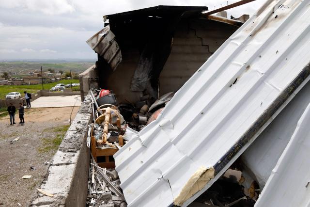 A photograph shows the damage after a drone crashed into a house in the village of Zargazawi, north of Erbil in Iraq's northern autonomous Kurdistan region, on April 7, 2026. Local authorities reported a deadly drone incident in a civilian area in the early hours of April 7. The autonomous region's Counter-Terrorism Service said a "bomb-laden drone coming from Iran" crashed into a home in the Dara Shakran subdistrict of Erbil province after midnight, killing a couple. Since the Middle East war erupted on February 28, shadowy Iraq-based groups have been claiming near daily attacks on US interests in the country and beyond. (Photo by Safin HAMID / AFP)