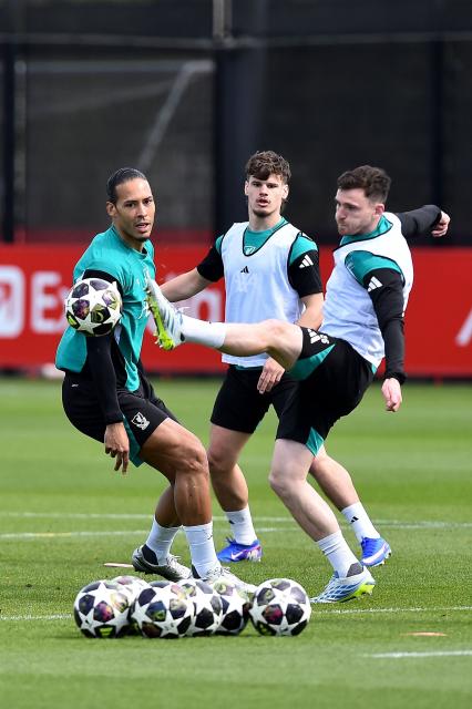 Liverpool's Dutch defender #04 Virgil van Dijk (L) attends a team training session at their training ground in Kirkby, Liverpool, north-west England on April 7, 2026, on the eve of their UEFA Champions League, quarter final first leg football match against Paris Saint-Germain. (Photo by PETER POWELL / AFP)