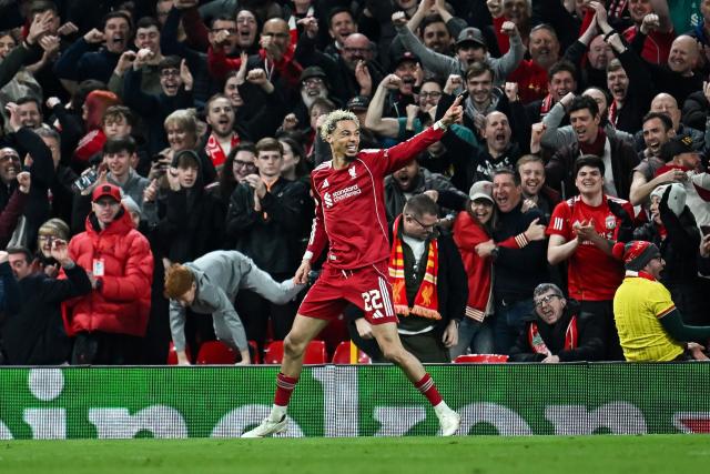 (FILES) Liverpool's French forward #22 Hugo Ekitike celebrates scoring his team's second goal during the UEFA Champions League, round of 16 second leg football match between Liverpool and Galatasaray at Anfield in Liverpool, north-west England on March 18, 2026. A rising star with a strong “personality” at Reims, Hugo Ekitikй subsequently struggled to make his mark at the star-studded PSG of the Mbappй-Neymar-Messi era, an experience he describes as “complicated but necessary” for the brilliant Liverpool striker, who returns to the Parc des Princes on April 8, 2026. (Photo by Paul ELLIS / AFP)