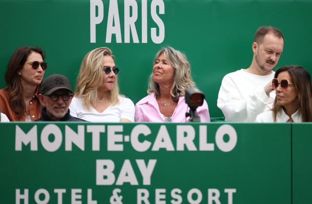 Members of the audience watch as Spain's Carlos Alcaraz plays against Argentina's Sebastian Baez during the Monte Carlo ATP Masters Series Tournament round of 64 tennis match on Court Rainier III at the Monte-Carlo Country Club in Roquebrune-Cap-Martin, south-eastern France on April 7, 2026. (Photo by Valery HACHE / AFP)