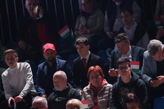 A person wears a MAGA (Make America Great Again) hat as they attend a rally of Hungarian Prime Minister Viktor Orban supported by US Vice President JD Vance (neither in picture) in Budapest on April 7, 2026. US Vice President JD Vance is in Hungary to deliver the US President's support to his ally, nationalist Prime Minister Viktor Orban, ahead of tightly contested parliamentary elections scheduled for April 12, 2026. (Photo by Jonathan Ernst / POOL / AFP)