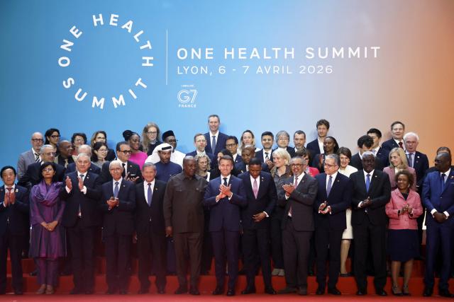 France's President Emmanuel Macron (C), world leaders and health experts attend a family photo during the "One Health Summit" high-level meeting session in Lyon, southern France on April 7, 2026, on the occasion of World Health Day. (Photo by Christophe PETIT TESSON / POOL / AFP)