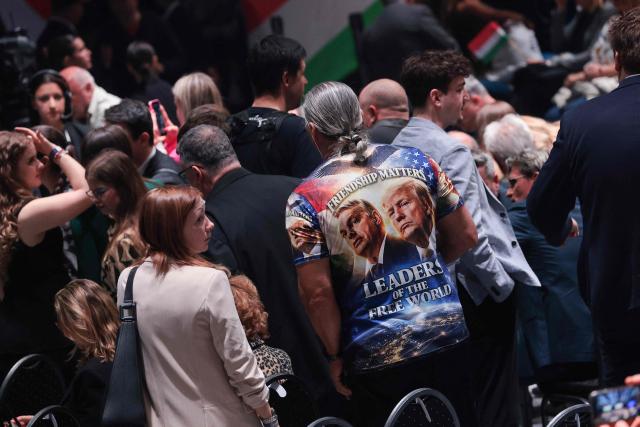 A person wears a shirt featuring an image of Hungarian Prime Minister Viktor Orban and US President Donald Trump which readfs "Friendship matters,- Leaders of the Free World" at a rally of Hungarian Prime Minister Viktor Orban supported by US Vice President JD Vance (neither in picture) in Budapest on April 7, 2026. US Vice President JD Vance is in Hungary to deliver the US President's support to his ally, nationalist Prime Minister Viktor Orban, ahead of tightly contested parliamentary elections scheduled for April 12, 2026. (Photo by Jonathan Ernst / POOL / AFP)